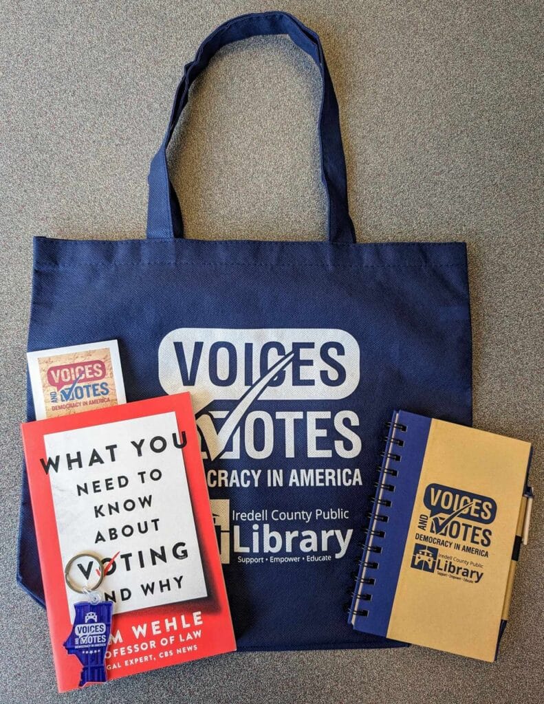 Giveaway bag with books and notepads