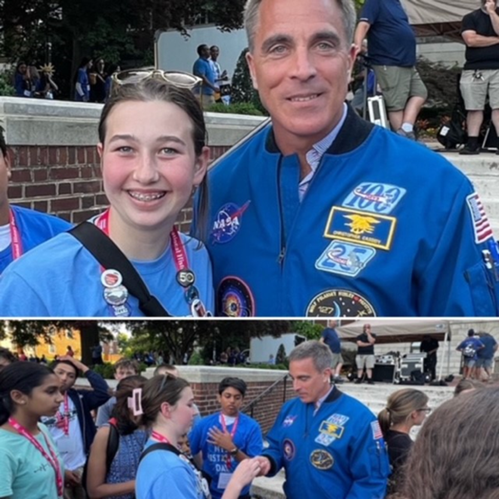 Murray presents National History Day pin to astronaut.