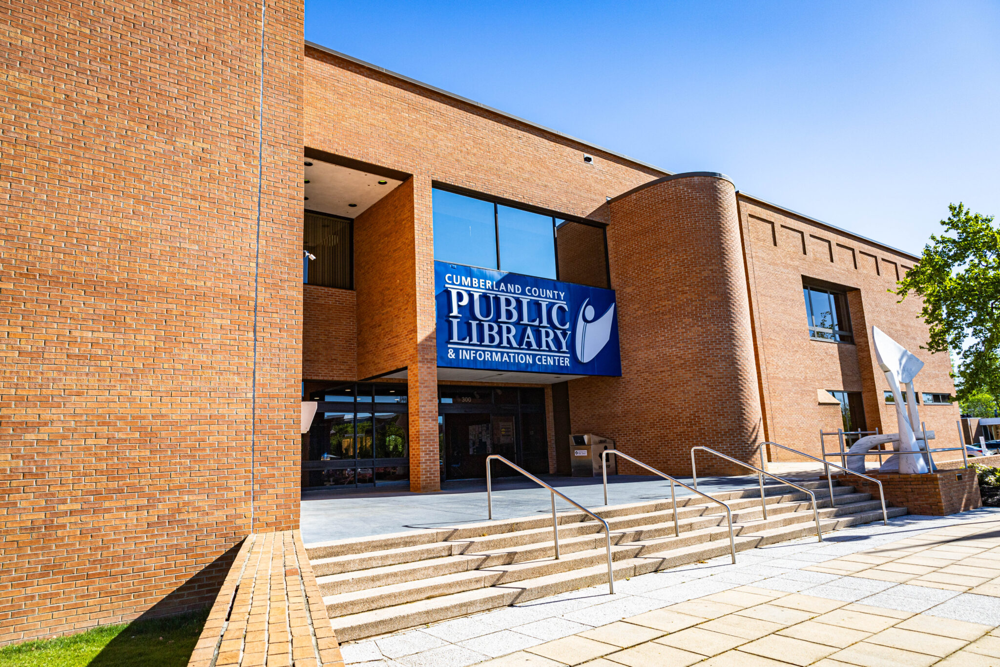 Exterior of library is brick and features a blue banner